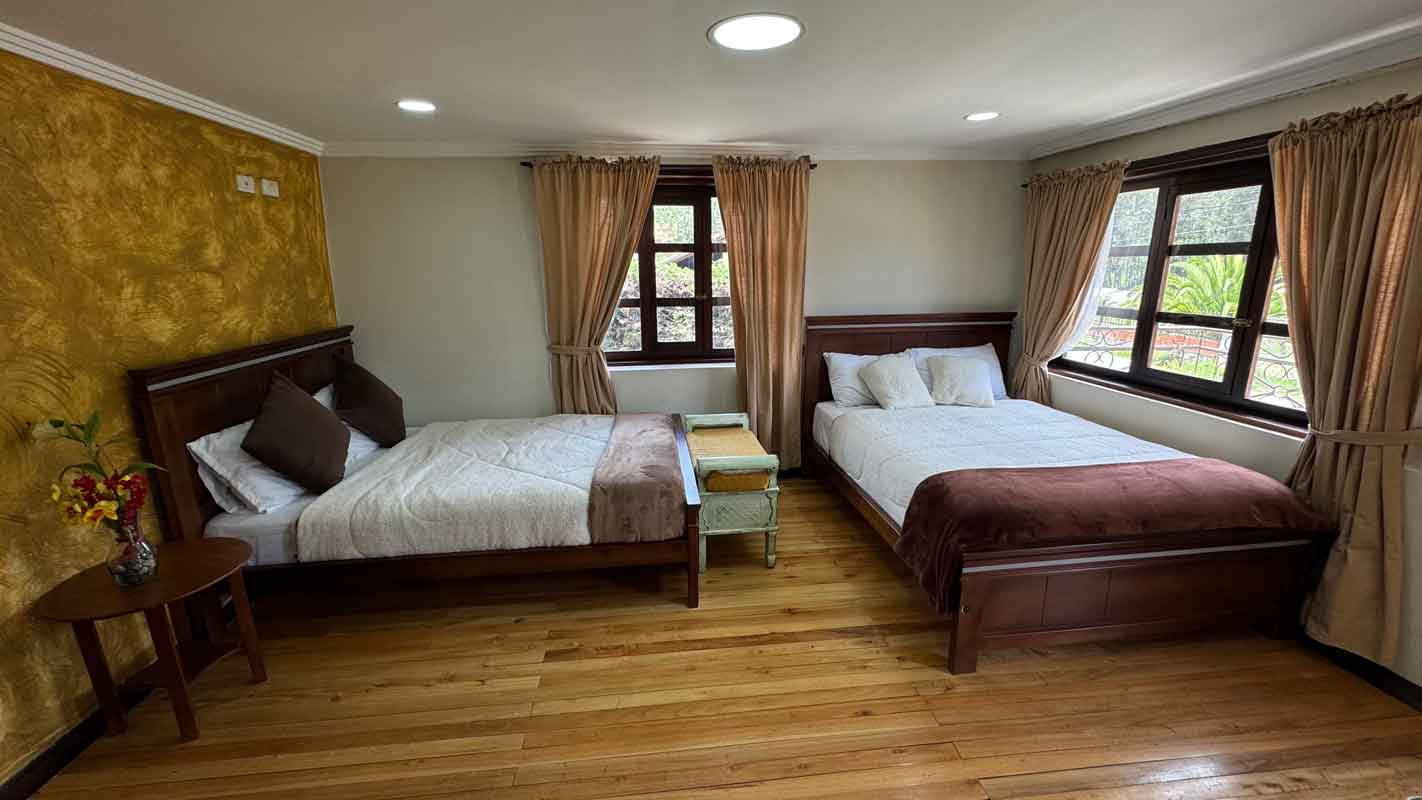 Room with two double beds