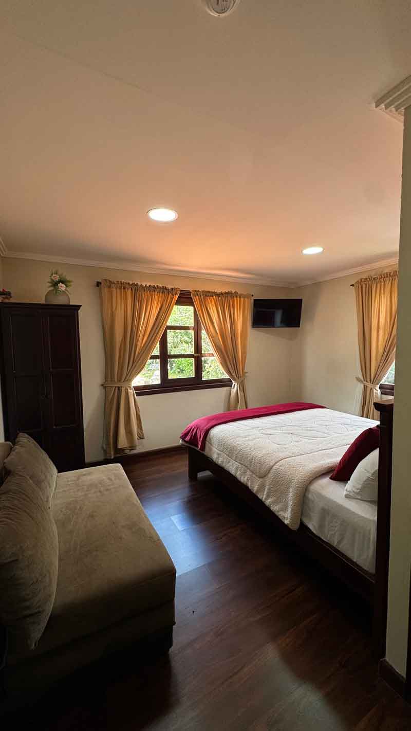 Room with sofa and large windows