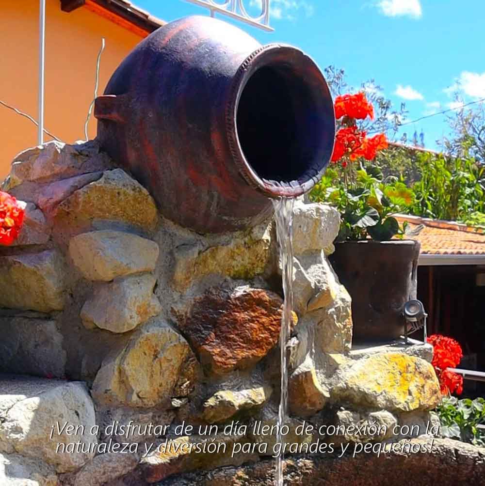 Stone fountain and flowers in the garden